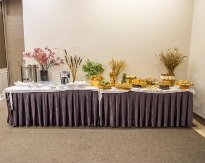 a table with cupcakes and other food on it at Sen Otel in Sakarya