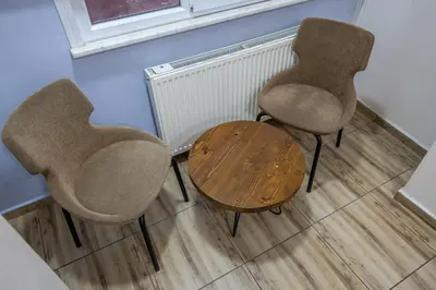 two chairs and a table in a room at LAOS OTEL in Istanbul