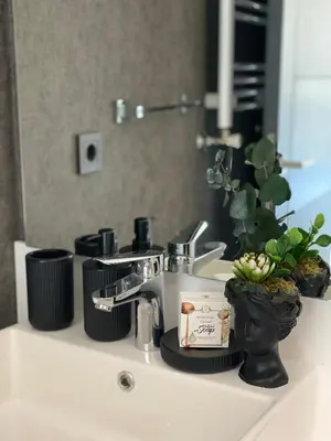 a bathroom sink with a plant on top of it at Luxury Duplex with Terrace Apartment by Siena Suites in Istanbul