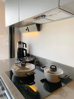 a kitchen with two bowls on top of a stove at Luxury Duplex with Terrace Apartment by Siena Suites in Istanbul