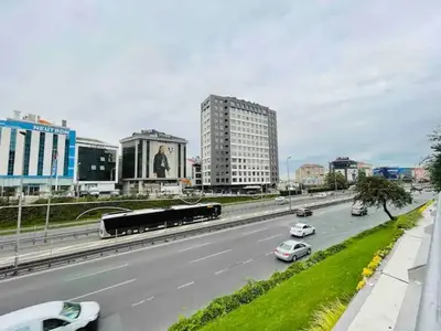 a highway with cars and a train in a city at Luxury Duplex with Terrace Apartment by Siena Suites in Istanbul