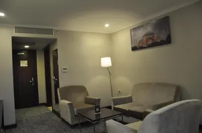 a waiting room with two chairs and a table at Happy Inn Gebze Hotel in Kocaeli
