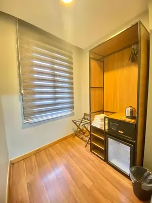 a room with a kitchen with a window and a stove at sahar sultan hotel in Istanbul