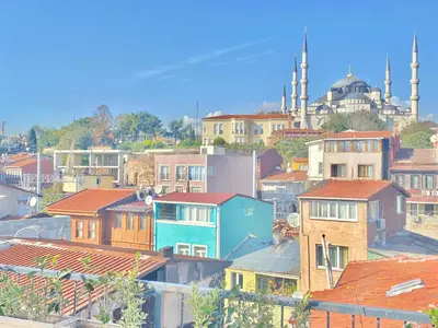 a group of buildings with a mosque in the background at sahar sultan hotel in Istanbul