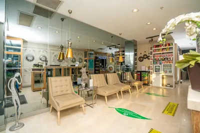 a store with chairs and a table and mirrors at The Gate Ataşehir Finance Centre in Istanbul