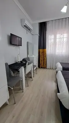 a room with a table and chairs and a desk at Golden Life GL in Istanbul