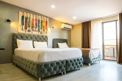 a hotel room with two beds in a room at Monezza Avcılar in Istanbul