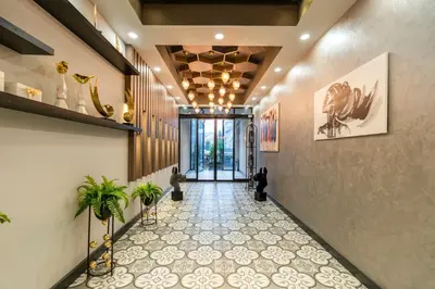a hallway with a tile floor and a ceiling at Monezza Avcılar in Istanbul
