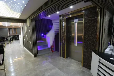 a hallway with a purple staircase in a restaurant at Nişantaşı Diamond Hotel in Istanbul