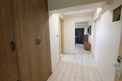 a hallway with a wooden door and a room at Nişantaşı Diamond Hotel in Istanbul