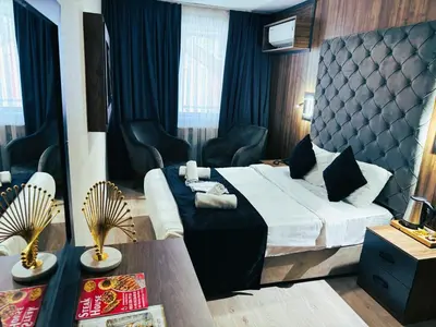 a hotel room with a bed and a table at Nişantaşı Diamond Hotel in Istanbul