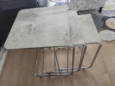 a table with a marble top on top of a floor at My G yoo Apartment #2 in Istanbul