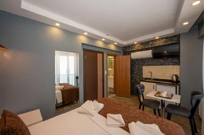 a hotel room with a bed and a kitchen and a bathroom at Taksim Story Residence in Istanbul