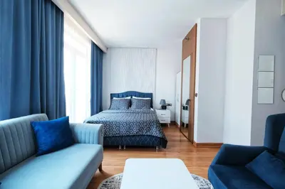 a bedroom with a bed and a couch at İstanbul Houses Sabiha Gökçen Airport in Istanbul