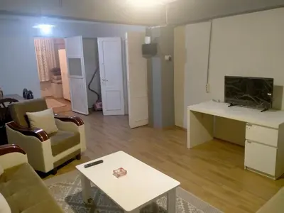 a living room with a couch and a table at 2 bedrooms central area located appartment 1floor in Istanbul