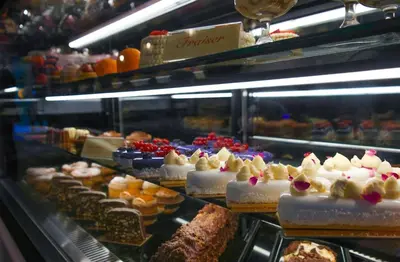 a display case with many different types of cakes and pastries at Ring Stone Hotels Bosphorus - Special Class in Istanbul