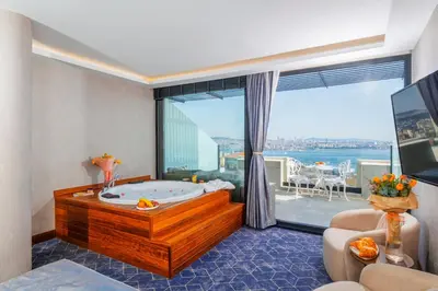 a large bathroom with a tub and a large window at Ring Stone Hotels Bosphorus - Special Class in Istanbul