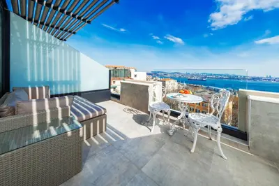 a patio with a table and chairs on a balcony at Ring Stone Hotels Bosphorus - Special Class in Istanbul