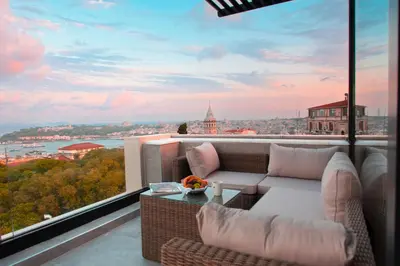 a balcony with a couch and a view of the city at Ring Stone Hotels Bosphorus - Special Class in Istanbul