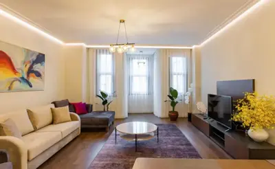 a living room with a couch and a tv at Taksim 360 Luxe Apartment Prime Istanbul Location in Istanbul