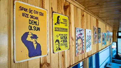 a wall with signs on the side of a building at KUMBAĞ ŞEHRİ SARAY APART OTEL in Tekirdag