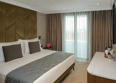 a hotel room with a large bed and a window at Hotel Nena Sultanahmet in Istanbul