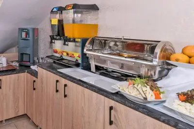 a kitchen with a counter with some food on it at Olimpic Hotel in Istanbul