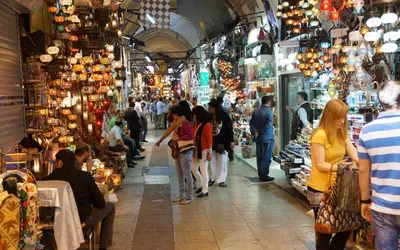 a group of people walking around a market in aazaar at Eresin Hotels Topkapı in Istanbul