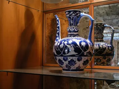 a blue and white vase sitting on a glass shelf at Eresin Hotels Sultanahmet - Boutique Class in Istanbul