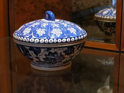 a blue and white vase sitting on a glass table at Eresin Hotels Sultanahmet - Boutique Class in Istanbul
