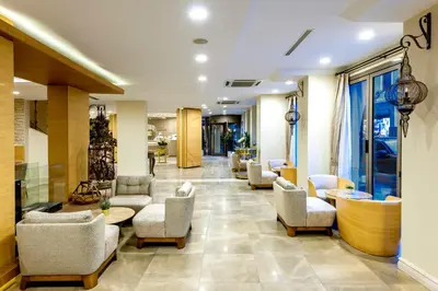 a lobby of a hospital with chairs and tables at Hotel Yasmak Sultan in Istanbul