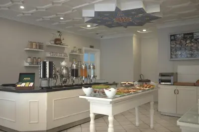 a kitchen with a table with food on it at Avicenna Hotel Sultanahmet in Istanbul