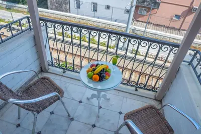 a plate of fruit on a table on a balcony at Avicenna Hotel Sultanahmet in Istanbul