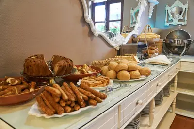 a buffet with many different types of bread and pastries at Celal Sultan Hotel Special Class in Istanbul