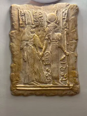 a relief of a man and a woman on a wall at Hanedan Hotel in Istanbul
