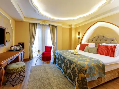 a hotel room with a bed and a desk at Romance Istanbul Hotel Boutique Class in Istanbul