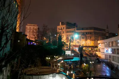 a city street at night with buildings and lights at Art Nouveau Galata in Istanbul