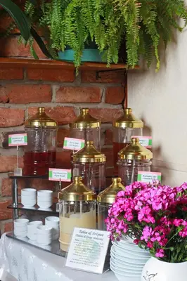 a display of jars and plates and flowers on a table at Dersaadet Hotel Istanbul in Istanbul