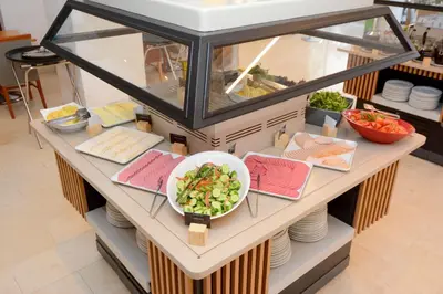 a buffet with a salad and a bowl of food at Holiday Inn Istanbul City by IHG in Istanbul