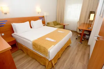 a hotel room with a bed and a desk at Holiday Inn Istanbul City by IHG in Istanbul