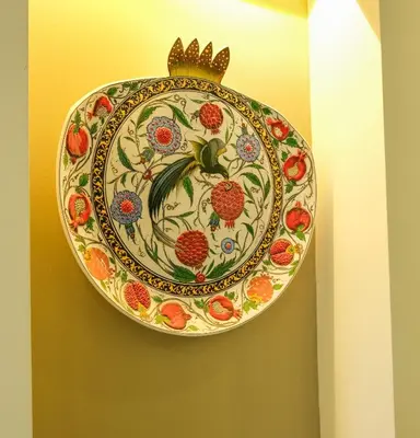 a plate with a crown hanging on a wall at Star Holiday Hotel in Istanbul