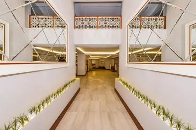 a hallway in a building with plants on the walls at Bergama Hotel Old City in Istanbul