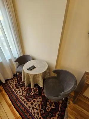a living room with two chairs and a table at Gul Sultan Hotel in Istanbul