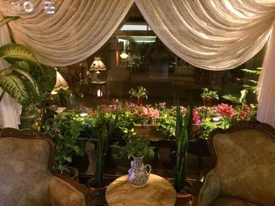 a window with a bunch of flowers in a room at Hotel Nezih Istanbul in Istanbul