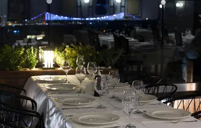 a table with plates and wine glasses on it at Orient Express & Spa by Orka Hotels in Istanbul