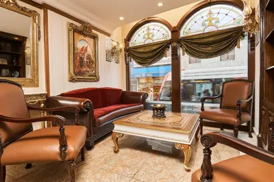 a living room with a couch and chairs and a table at Best Western Empire Palace Hotel & Spa in Istanbul