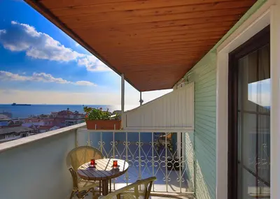 a patio with a table and chairs on a balcony at Hotel Historia-Special Category in Istanbul
