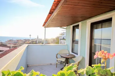 a patio with a table and chairs on a balcony at Hotel Historia-Special Category in Istanbul