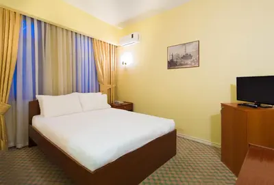 a hotel room with a bed and a television at Hotel Historia-Special Category in Istanbul
