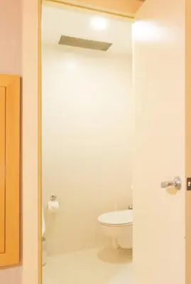 a bathroom with a toilet and a glass shower door at Antik Hotel Istanbul in Istanbul